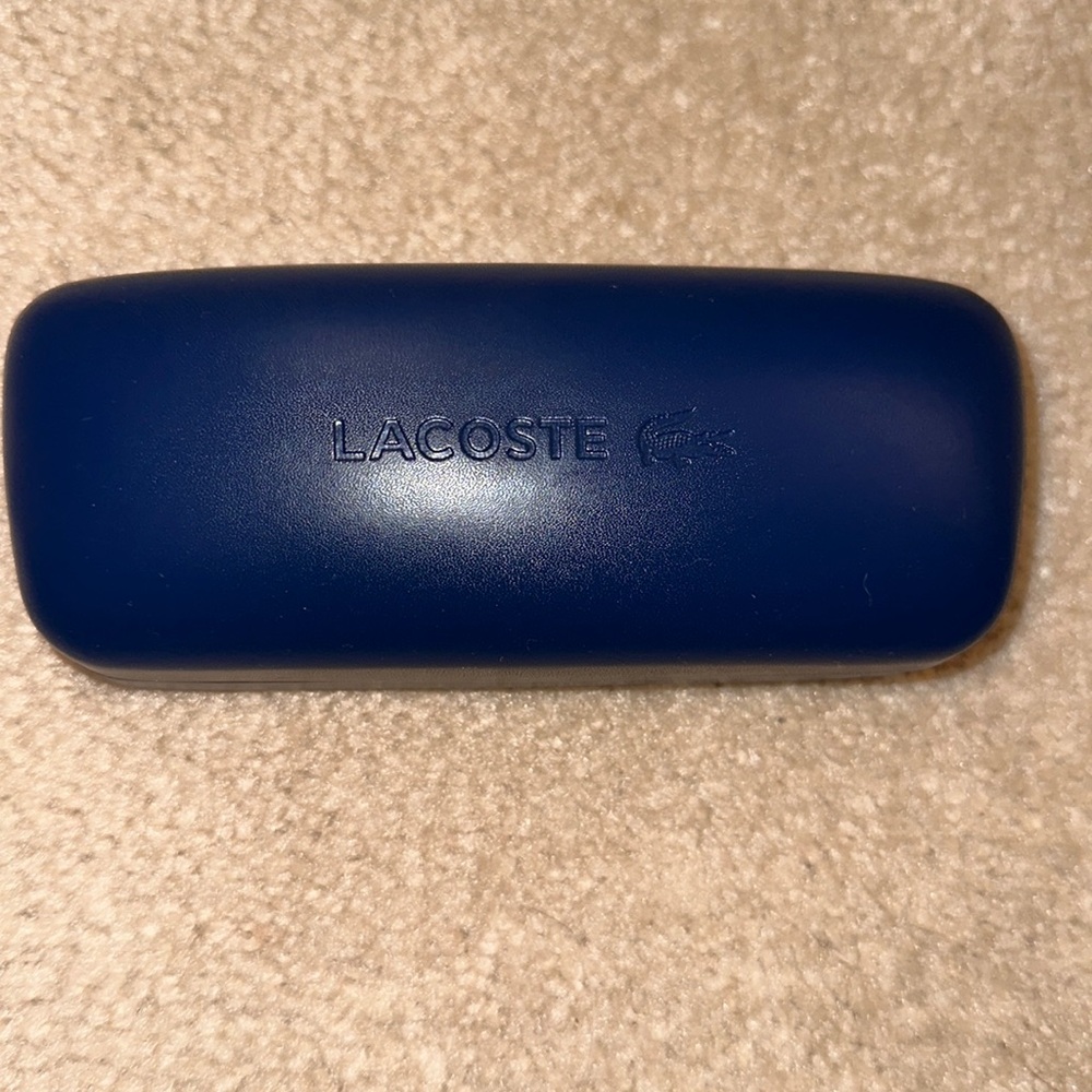 Lacoste sunglass / eyeglass case
New without tags 
Navy blue 
White inside